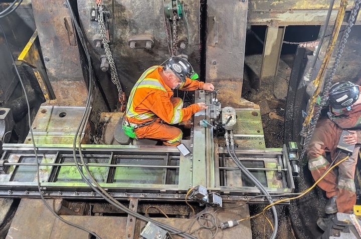 Machinist Working in Large Industrial Plant